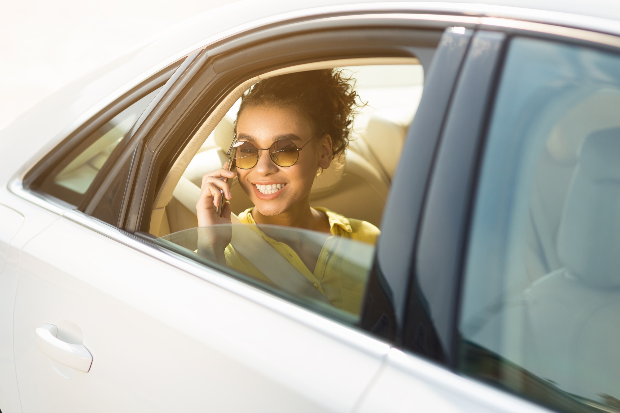 Smiling Local Connect driver welcoming guests at the airport